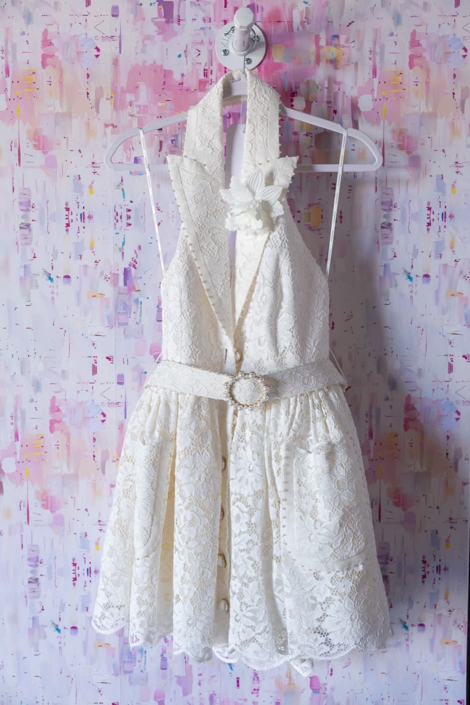 A white lace halter dress on the Lemon Park wall